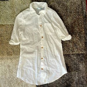 Oversized white blouse.